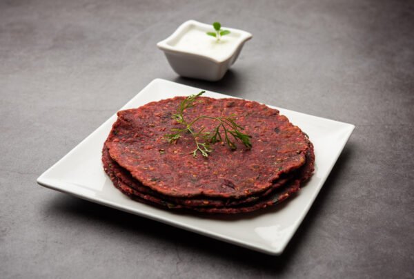 Indian food Beetroot paratha served with Curd, selective focus